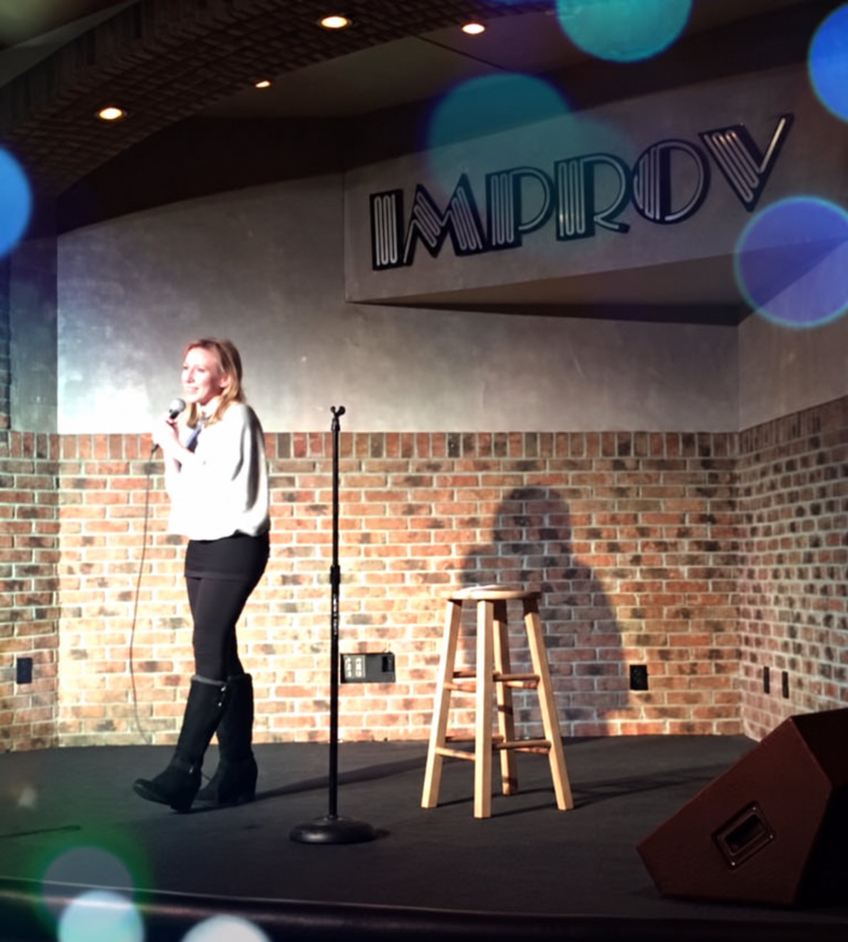 Bitcoin Rose Comedy performing on the Improv main-room stage